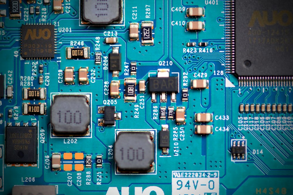 Close-up of a blue printed circuit board with fine copper traces