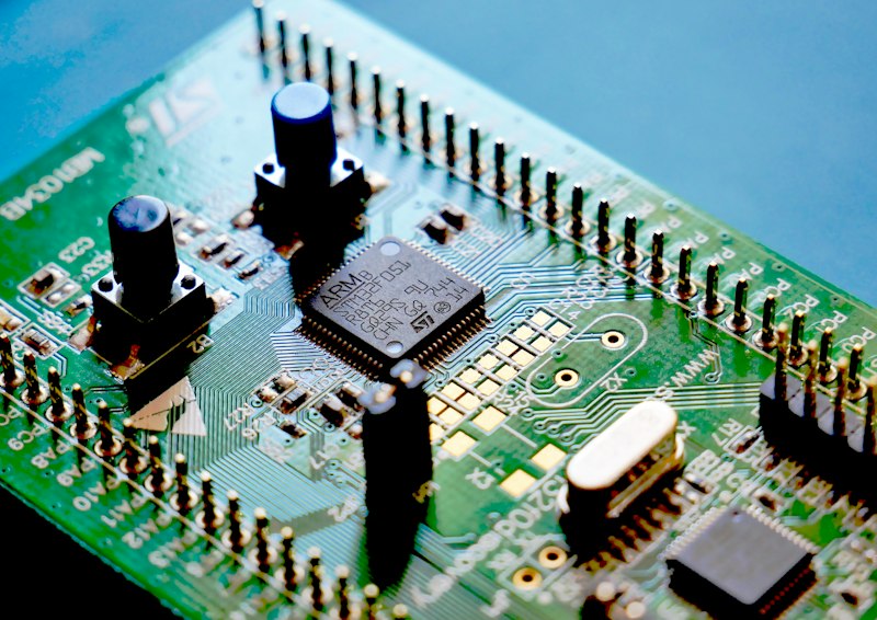 Green circuit board populated with electronic components