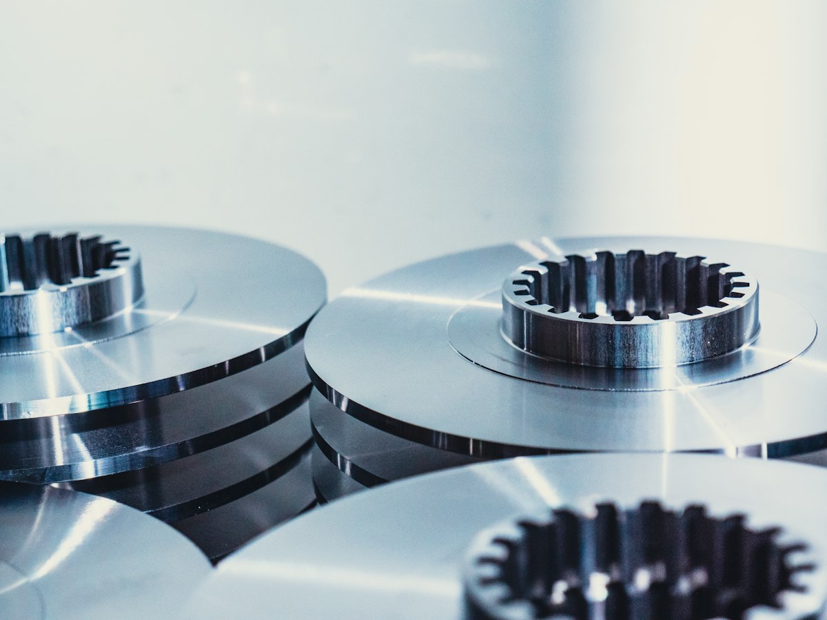 Precision-turned steel discs and a splined component under studio lighting